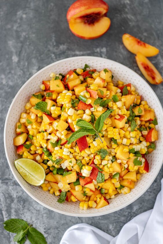 fresh nectarine corn salsa, Fresh Nectarine Corn Salsa in a large serving bowl and surrounded by nectarine slices fresh mint and a white towel