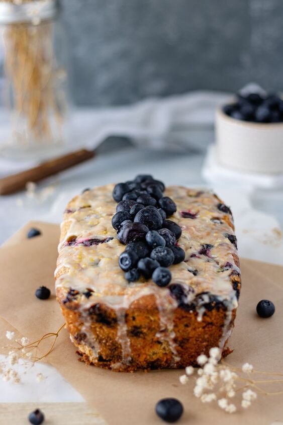 Lemon Blueberry Zucchini Bread topped with a pile of fresh blueberries