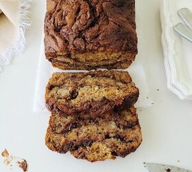 nutella banana bread, functional image nutella banana bread top down view with two slices cut a dirty knife and white places with scalloped edges