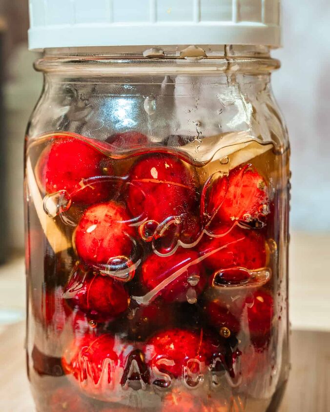 honey fermented cranberries, mason jar filled with fermented cranberry honey