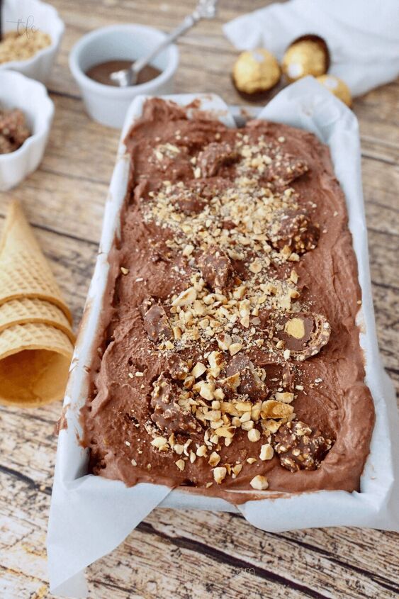 Sprinkle with reserved hazelnuts and chopped Ferrero chocolatse