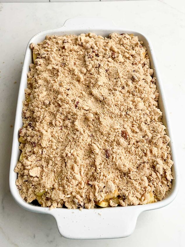 apple crisp without oatmeal, unbaked apple crisp without oatmeal in a white casserole dish