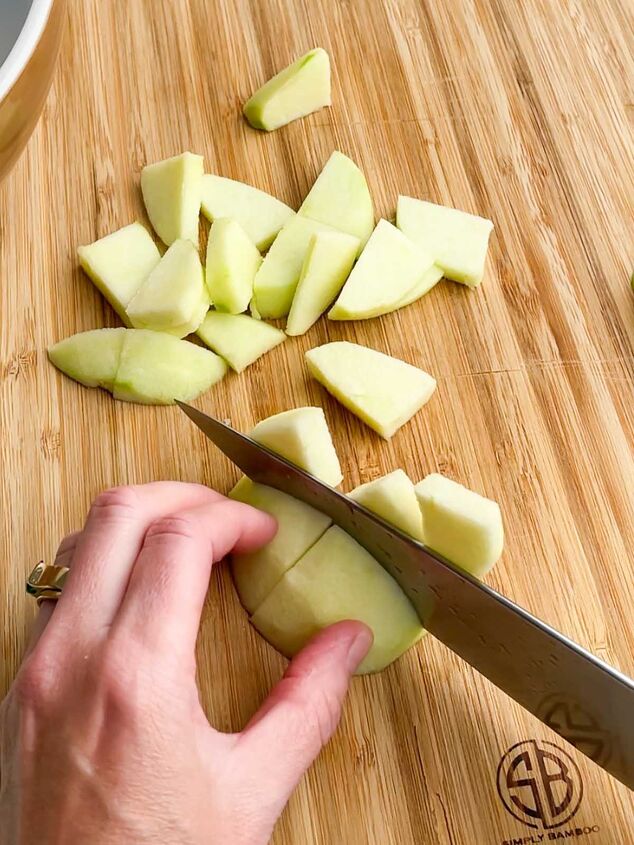 apple crisp without oatmeal, knife slicing an apple into thin slices