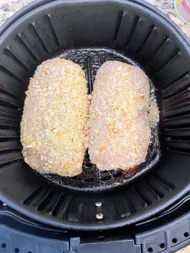 air fryer chicken cordon bleu, Breaded chicken cordon bleu ready to be cooked in the air fryer basket