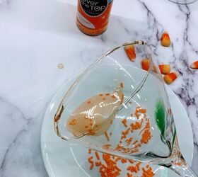 two fun halloween cocktails, Coat the rim with corn syrup and then dip in orange sprinkles or orange sugar for these fun Halloween cocktails
