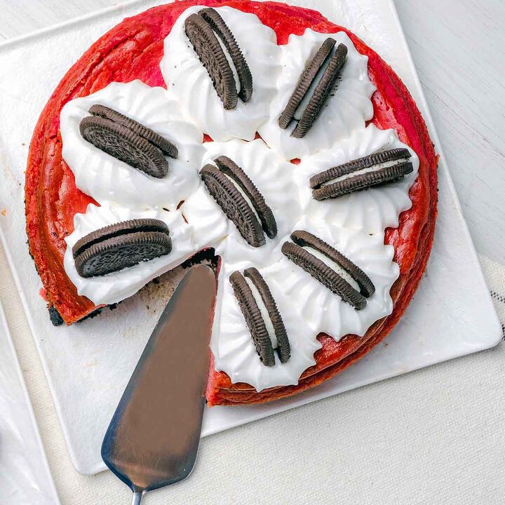 Oreo red velvet cheesecake with a slice taken out