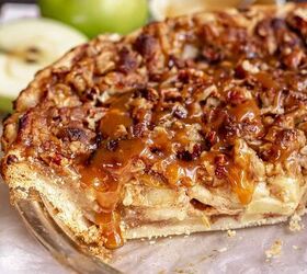 dutch caramel apple pie with crumb topping, Caramel apple pie in a a pie dish with caramel drizzling over a cut slice