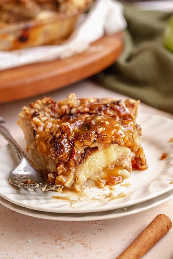 dutch caramel apple pie with crumb topping, Slice of caramel apple pie on a plate with a bite removed