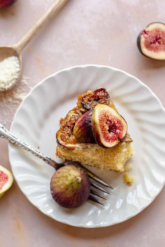 upside down almond fig cake, A slice of cake on a plate with a fork and bite removed