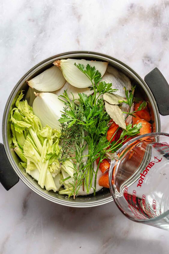 pennsylvania dutch chicken pot pie, Water being poured into a pot of chicken stock before boiling