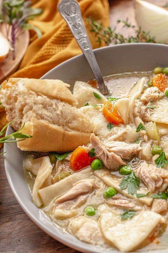 pennsylvania dutch chicken pot pie, A bowl of PA dutch chicken pot pie in a bowl with a spoon and piece of bread resting on the side