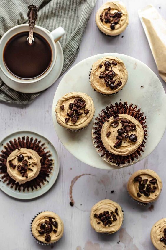 chocolate mocha cupcakes with espresso frosting, Mocha cupcakes strewn about a counter with coffee on the side