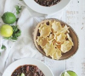 easy slow cooker black bean soup, easy black bean soup 2 white bowls wood bowl of scoops chips and limes 2