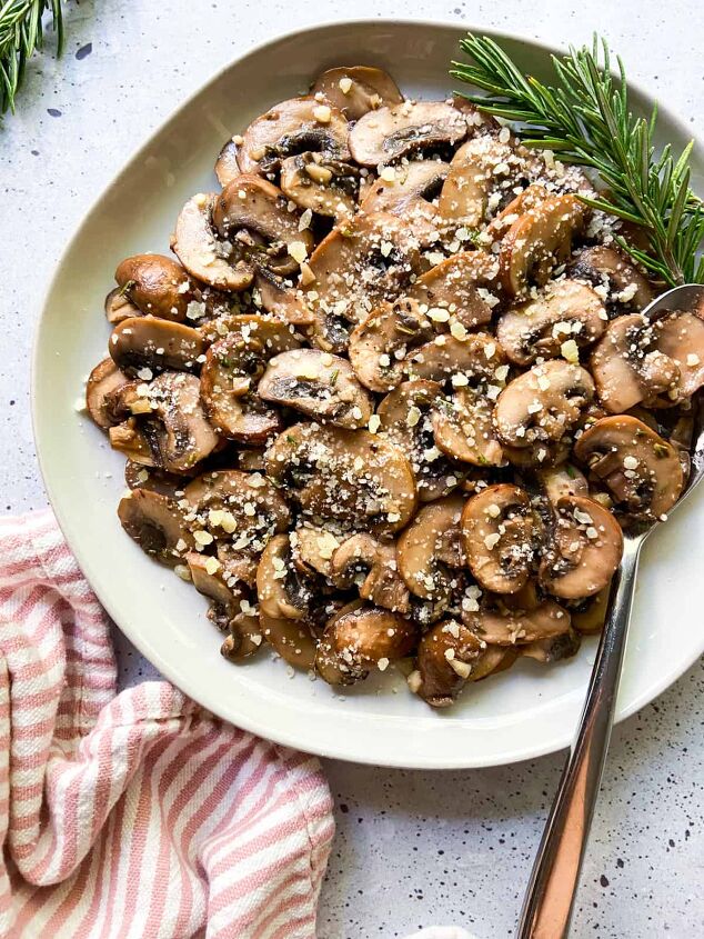 garlic butter mushrooms with rosemary, A plate of mushrooms with parmesan and rosemary