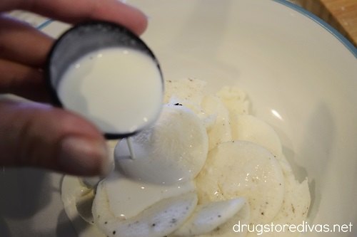 Milk being poured into cream from Oreo cookies