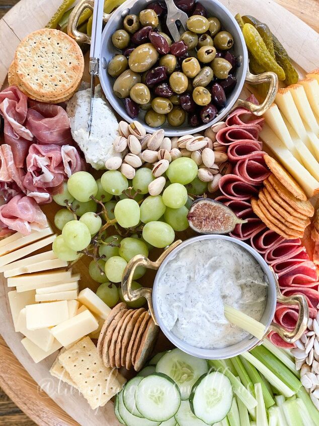 what we put on a fall charcuterie board, a view of meats cheeses nuts crackers and dips on my fall charcuterie board