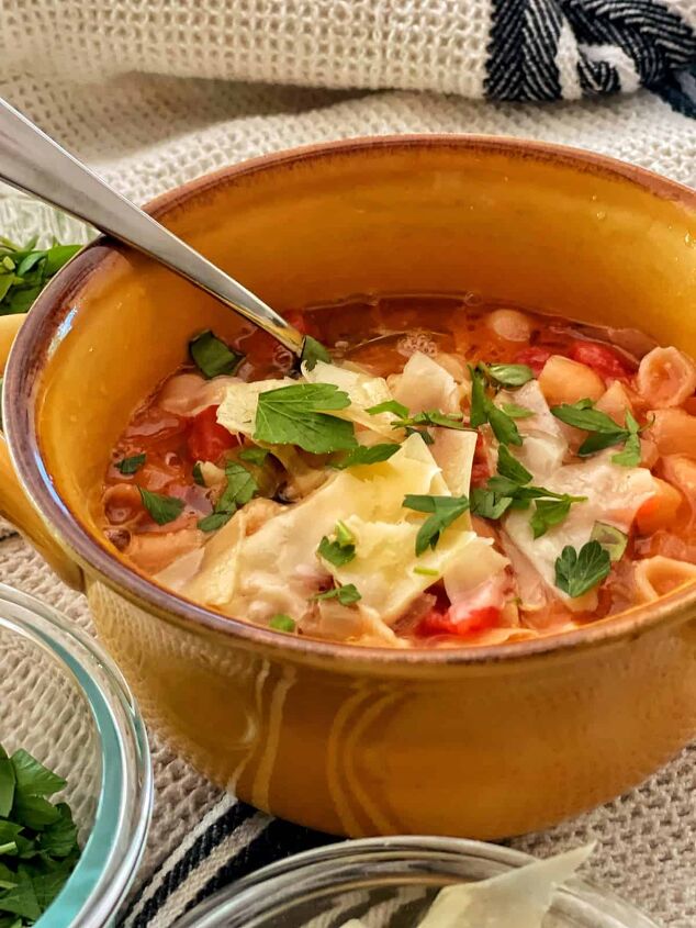 best recipe for pasta fagioli soup, close up of the best recipe for pasta fagioli in mustard color bowl with spoon
