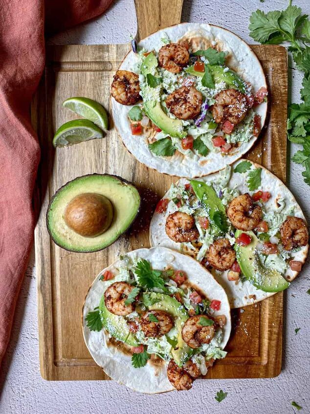 air fryer shrimp tacos with slaw happy honey kitchen, Three air fried shrimp tacos with slaw avocado cilantro and creamy jalapeno salsa are open face on a cutting board Lime wedges and an avocado are on the side