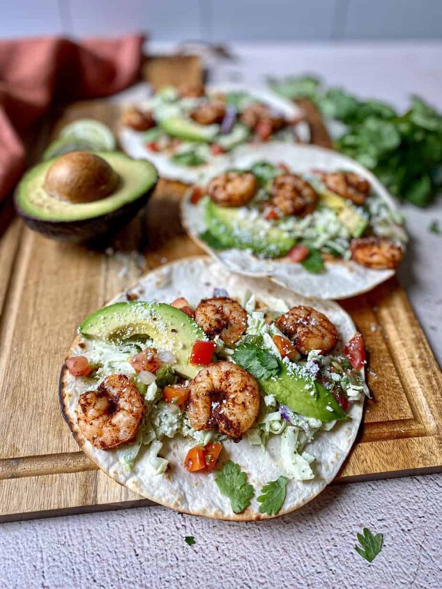 air fryer shrimp tacos with slaw happy honey kitchen, Low carb shrimp tacos are on a cutting board Toppings for shrimp tacos are creamy jalapeno slaw cilantro avocado and pico de gallo
