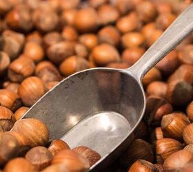 hazelnuts with a metal scoop in them