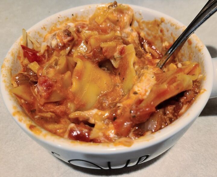 easy crockpot lasagna soup recipe, Cooked Lasagna Soup in bowl topped with cheeses and stirred after cheese melts