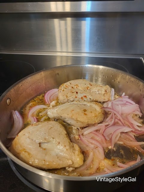 chicken casserole and rice, Chicken and red onion cooking together in skillet