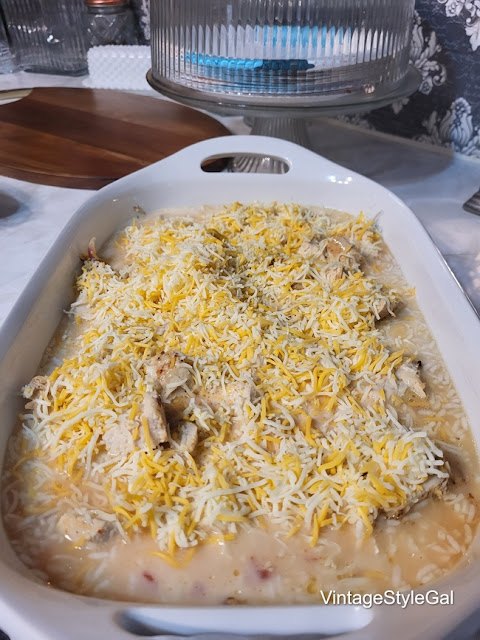 chicken casserole and rice, milk and egg added to baking dish