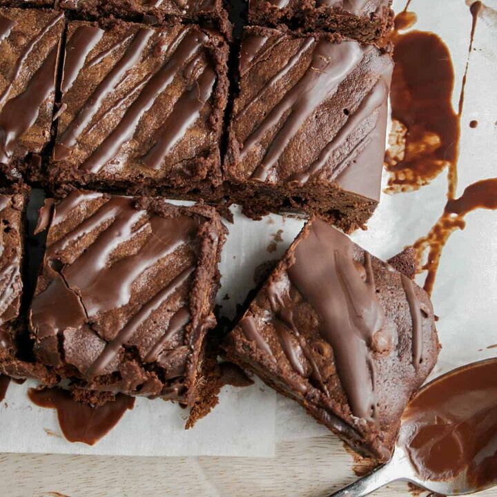 double chocolate irish coffee brownies, Double Chocolate Irish coffee Brownies with a chocolate drizzle Photographed on a sheet of parchment paper on a Calcutta marble board