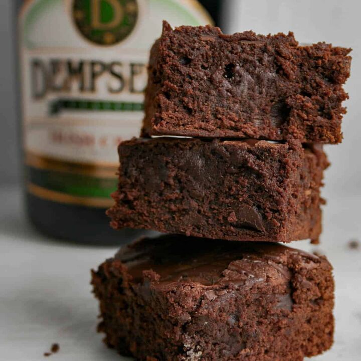 double chocolate irish coffee brownies, Stack of Double Chocolate Irish coffee Brownies with a bottle of Dempsey s Irish cream in the background