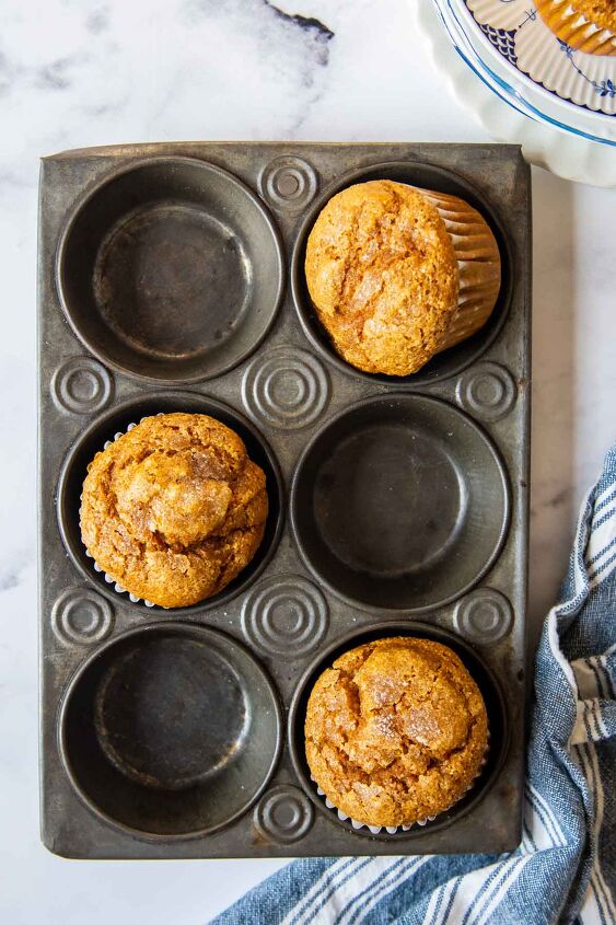 pumpkin oat flour muffins, overhead shot of pumpkin oat flour muffins in a vintage muffin pan