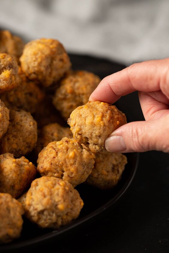 non greasy sausage balls with flour, A sausage ball being removed from a platter