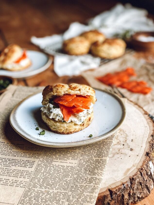 feta chive buttermilk biscuits with cream cheese and salmon, Feta chive buttermilk biscuit on a plate over newspaper