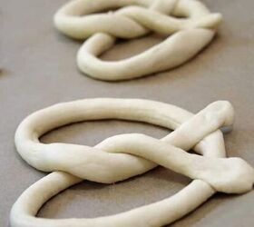 pretzel dough in classic pretzel shape on parchment paper