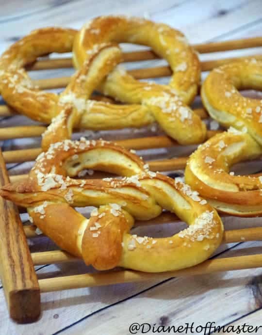 German soft pretzels on a wood cooling rack