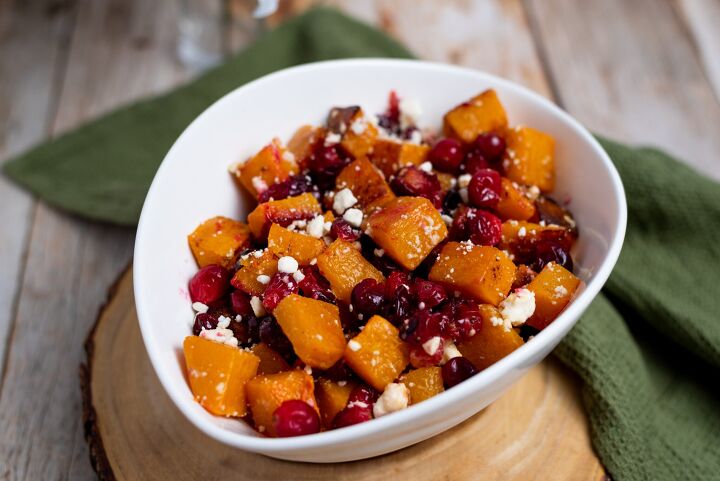 oven roasted butternut squash with cranberries and feta, bowl of oven roasted butternut squash with cranberries and feta cheese