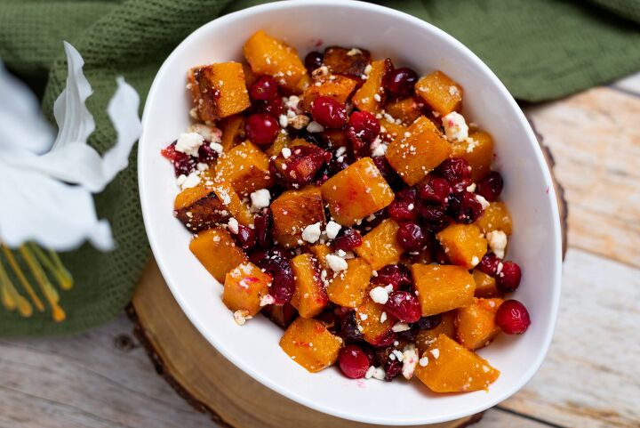 oven roasted butternut squash with cranberries and feta, White bowl of roasted butternut squash with cranberries and feta