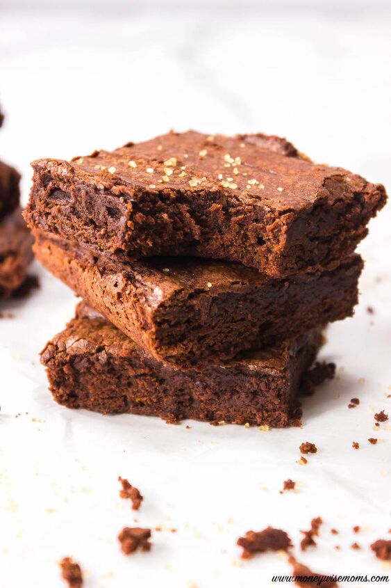 stack of brownies with one with a bite out of it