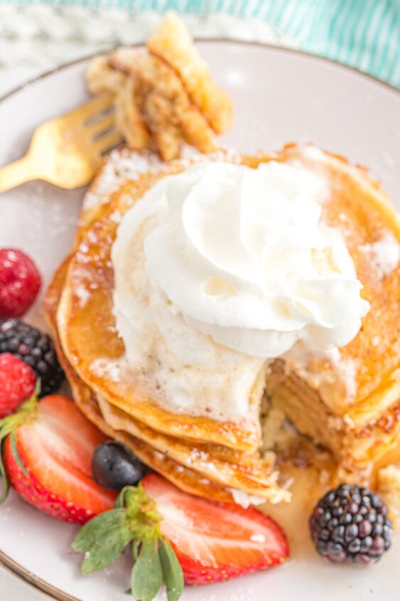 sweet cream pancakes, Pancakes on a plate topped with whipped cream