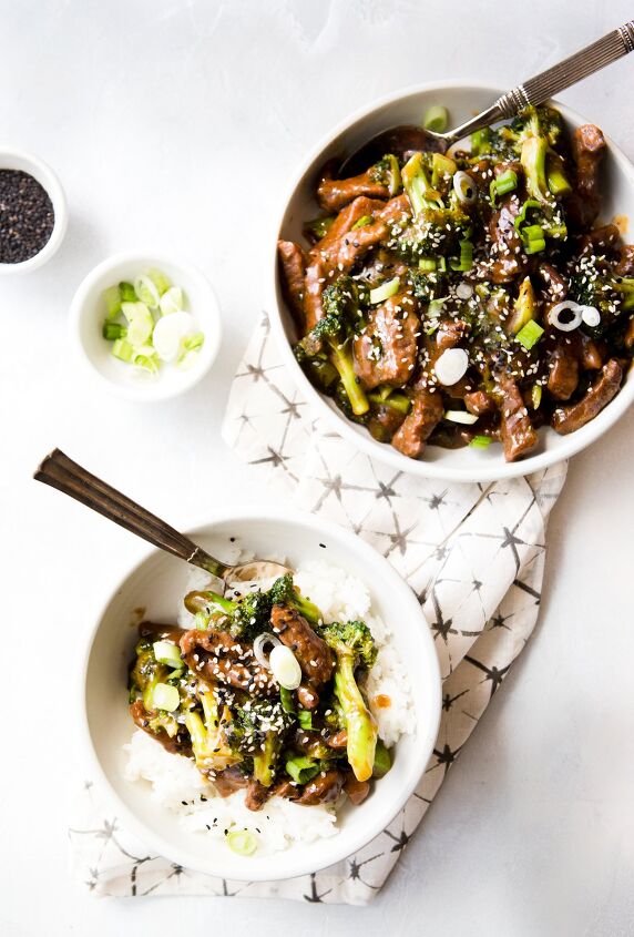 instant pot beef and broccoli, chinese takeout copycat beef and broccoli being served in a white bowl over rice