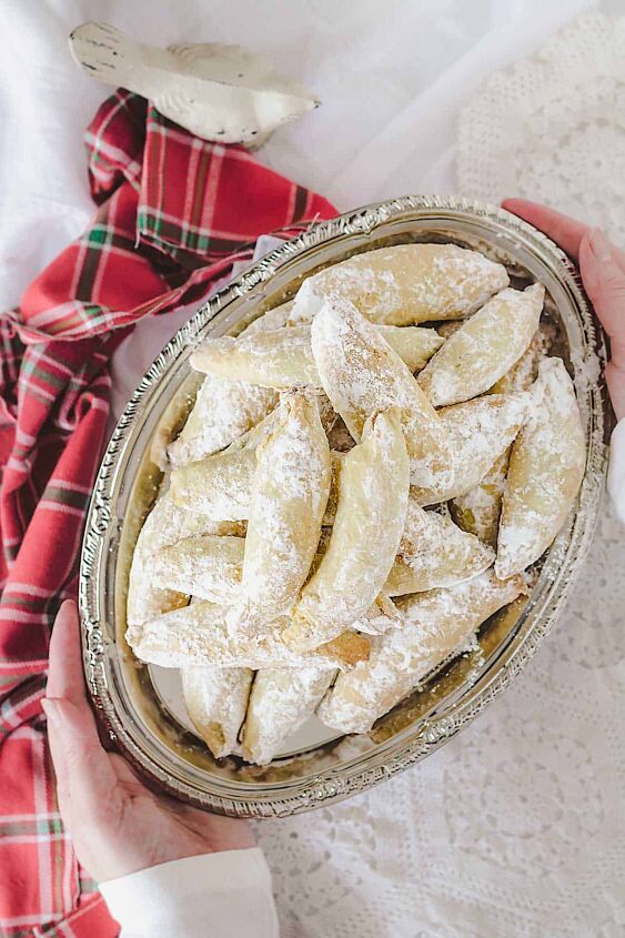 polish christmas cookies kifli, A person serving Polish kiflies on a tray