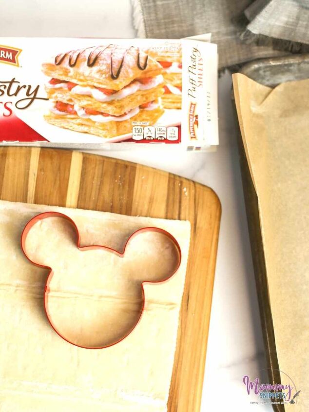 an easy puff pastry cherry turnover recipe for mickey mouse fans, Mickey Mouse cookie cutter on a puff pastry sheet