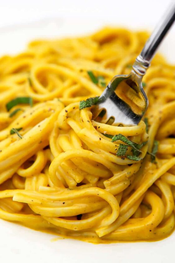 vegan pumpkin pasta, A fork full of linguini with vegan pumpkin sauce on it