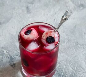 sip slurp and shiver devilishly delicious halloween drink recipes, Blueberry Lychee Eyeball Cocktail