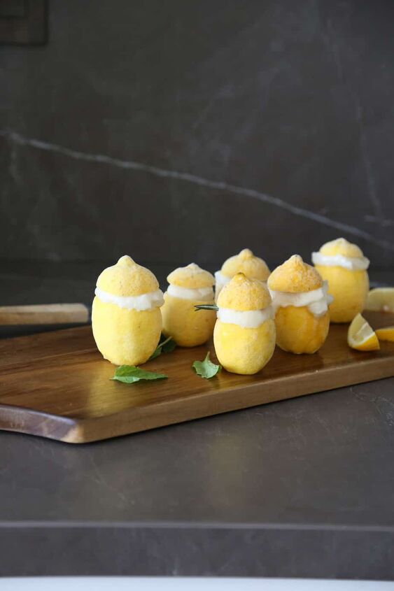 keto italian lemon sorbet recipe gluten free vegan, cutting board full of lemons served with lemon sorbet inside