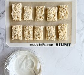 mummy rice krispie treats, Rice Krispie treats on a baking mat with a bowl of white chocolate