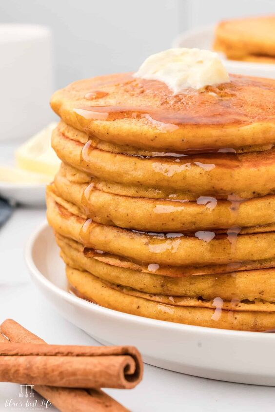 easy fluffy pumpkin pancakes with pancake mix, A stack of pumpkin pancakes with syrup drizzle