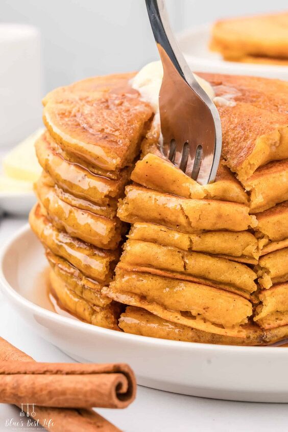 easy fluffy pumpkin pancakes with pancake mix, A fork full of pumpkin pancakes