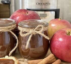 easy crockpot apple butter, Easy crockpot apple butter in a jar with apples and cinnamon sticks in front of a crockpot