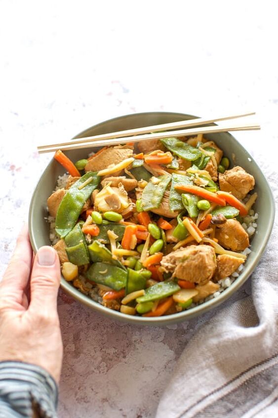 instant pot chicken stir fry, instant pot chicken stir fry in a green bowl with chopsticks