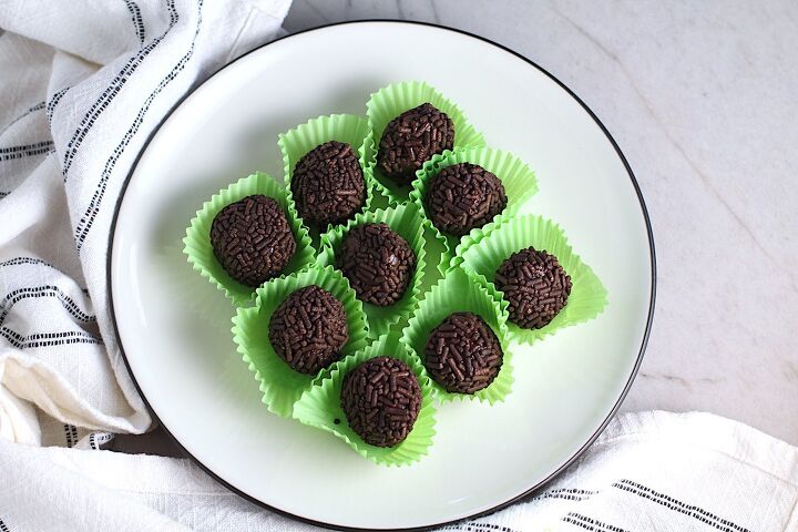 Brigadeiros Brazilian Chocolate Dessert truffles in green paper on a plate This Brigadeiro Recipe is based on traditional Brazilian chocolate truffles rolled in sprinkles You won t believe how easy they are to make